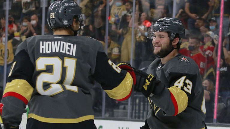 Vegas Golden Knights center Paul Cotter (43) celebrates scoring with Vegas Golden Knights center Brett Howden (21) during the second period of an NHL hockey preseason game Sunday, Sept. 26, 2021, in Las Vegas. (Ronda Churchill/AP)