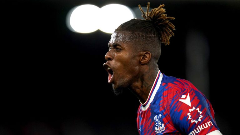 Crystal Palace's Wilfried Zaha celebrates scoring the opening goal during the English Premier League soccer match between Crystal Palace and Brentford at Selhurst Park, London, Tuesday Aug. 30, 2022. (Nick Potts/PA via AP)