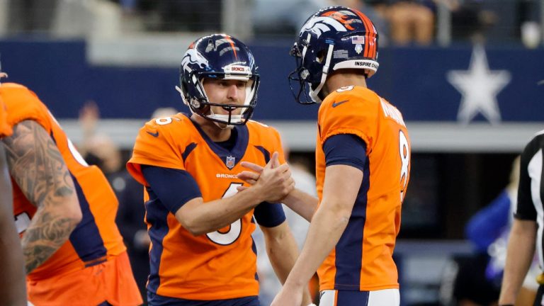 Denver Broncos punter Sam Martin (6) and place kicker Brandon McManus (8) celebrate a field goal scored by McManus in the first half of an NFL football game against the Dallas Cowboys in Arlington, Texas, Sunday, Nov. 7, 2021. (Michael Ainsworth/AP)