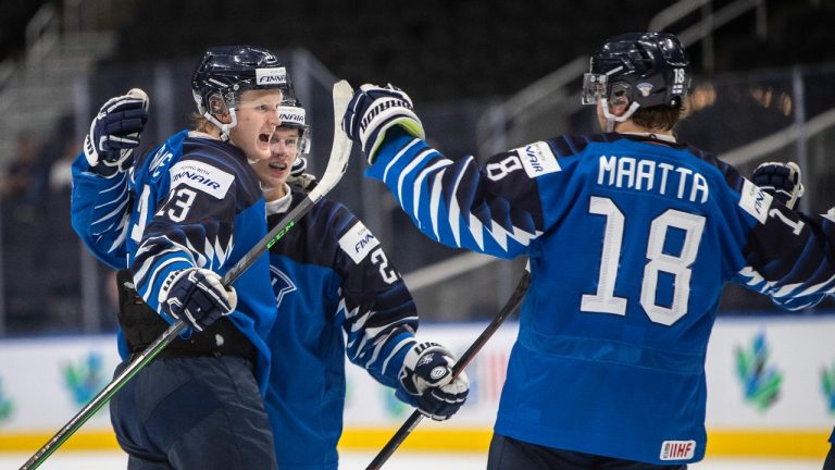 Finland's Roby Jarventie (13), Aleksi Heimosalmi (21) and Joel Maatta (18) celebrate a goal against Germany during third period IIHF World Junior Hockey Championship quarterfinal action in Edmonton on Wednesday August 17, 2022. (Jason Franson/THE CANADIAN PRESS)