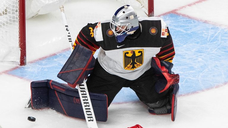 Russia's Maxim Groshev (28) is stopped by Germany goalie Florian Bugl (29) during first period IIHF World Junior Hockey Championship action in Edmonton on Saturday, January 2, 2021. (Jason Franson/CP)