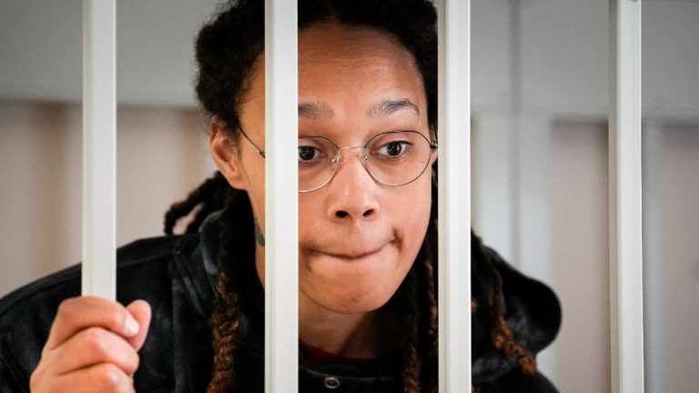 WNBA star and two-time Olympic gold medalist Brittney Griner speaks to her lawyers standing in a cage at a court room prior to a hearing, in Khimki just outside Moscow, Russia, Tuesday, July 26, 2022. (Alexander Zemlianichenko/AP Photo)