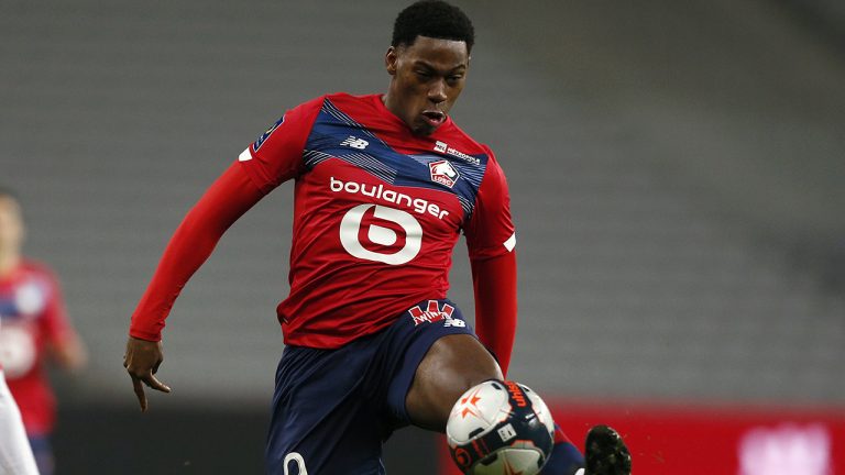 Lille's Jonathan David controls the ball during the French League One soccer match between Lille and Dijon at the Stade Pierre Mauroy stadium in Villeneuve d'Ascq, northern France, Sunday, Jan. 31, 2021. (Michel Spingler/AP)