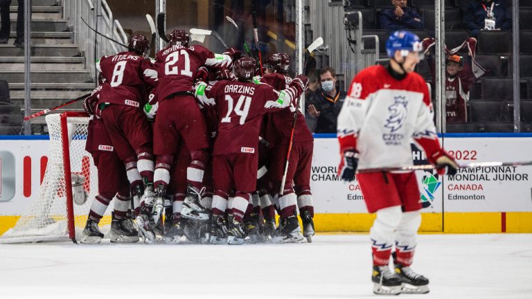 Latvia celebrates the win over Czechia during third period IIHF World Junior Hockey Championship action in Edmonton on Sunday August 14, 2022. (Jason Franson/CP)