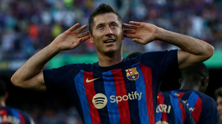 Barcelona's Robert Lewandowski celebrates after scoring his side's opening goal during a Spanish La Liga soccer match between FC Barcelona and Valladolid CF at the Camp Nou stadium in Barcelona. (Joan Monfort/AP)