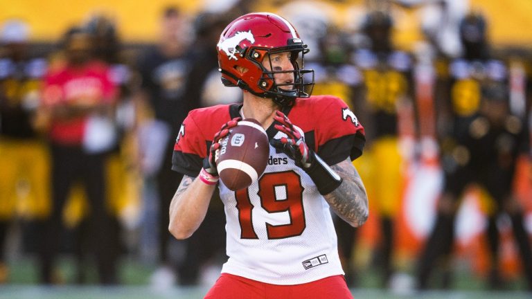 Calgary Stampeders quarterback Bo Levi Mitchell throws the ball against the Hamilton Tiger-Cats during first half CFL football action in Hamilton, Ont., Saturday, June 18, 2022. (Mark Blinch/THE CANADIAN PRESS)