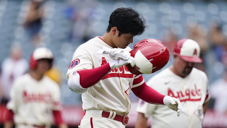 Los Angeles Angels' Shohei Ohtani takes off his helmet after he popped out to end the baseball game against the Oakland Athletics on Thursday, Aug. 4, 2022, in Anaheim, Calif. The Athletics won 8-7. (Jae C. Hong/AP)