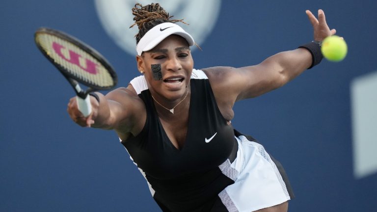 Serena Williams, of the USA, reaches for the ball against Belinda Bencic, of Switzerland, during the National Bank Open tennis tournament in Toronto on Wednesday, August 10, 2022. (Nathan Denette/CP)