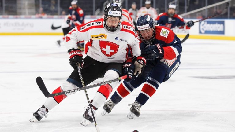 Switzerland's Simon Knak (8) is chased by Slovakia's Matej Ilencik (4) during third period Hlinka Gretzky Cup action in Edmonton on Wednesday, August 8, 2018. Slovakia won 5-3. (Codie McLachlan/CP)