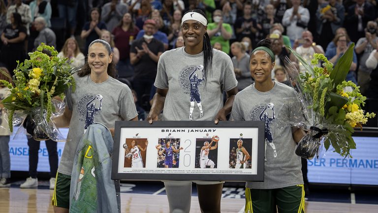 Seattle Storm guard Sue Bird, left, Minnesota Lynx centre Sylvia Fowles, center, and Storm guard Briann January are honored before a WNBA basketball game Friday, Aug. 12, 2022, in Minneapolis. (Elizabeth Flores/Star Tribune via AP)