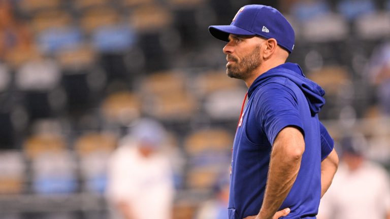 Texas Rangers manager Chris Woodward waits for players to come off the field after a win over the Kansas City Royals in a baseball game Tuesday, June 28, 2022, in Kansas City, Mo. (Reed Hoffmann/AP)