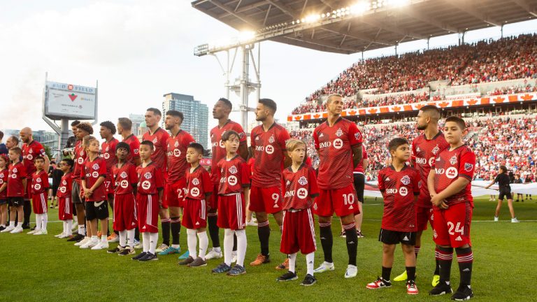 Toronto FC's Lorenzo Insigne (right) and Federico Bernardeschi (second right) line up for the anthems before first half MLS action against in Toronto on Saturday July 23, 2022. (Chris Young/CP)