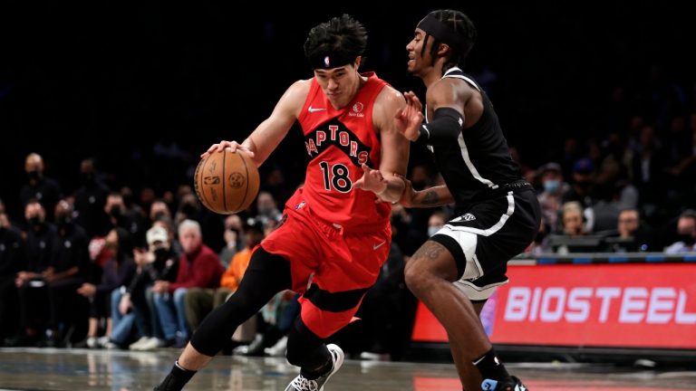 Toronto Raptors forward Yuta Watanabe (18) drives against Brooklyn Nets guard David Duke Jr. during the first half of an NBA basketball game Tuesday, Dec. 14, 2021, in New York. (Adam Hunger/AP)