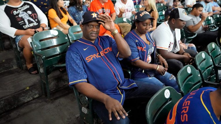 The parents of Houston Astros' Yordan Alvarez, AgustÃ­n Eduardo Ãlvarez Salazar, left, and Mailyn Cadogan Reyes watch the Minnesota Twins and Houston Astros play a baseball game Tuesday, Aug. 23, 2022, in Houston. Alvarez's parents got to see him play as a professional for the first time Tuesday night after arriving from Cuba Friday. (David J. Phillip/AP)