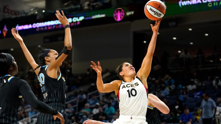 Las Vegas Aces' Kelsey Plum (10) scores past Chicago Sky's Azura Stevens during the first half of the WNBA Commissioner's Cup basketball game Tuesday, July 26, 2022, in Chicago. (Charles Rex Arbogast/AP)