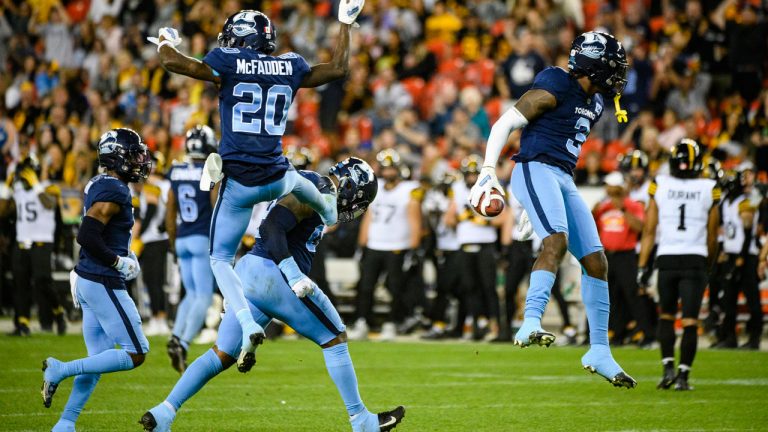 Toronto Argonauts defensive back Jamal Peters (3) celebrates after scoring a touchdown by intercepting a pass by Hamilton Tiger-Cats quarterback Dane Evans (9), during second half CFL football action in Toronto. (Christopher Katsarov/CP)