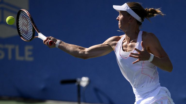 Liudmila Samsonova, of Russia, returns a shot against Xiyu Wang, of China, during a match at the Citi Open tennis tournament Saturday, Aug. 6, 2022, in Washington. (Nick Wass/AP)