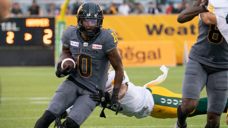 Hamilton Tiger Cats wide receiver Bralon Addison (0) runs for a gain during first half CFL football game action against the Edmonton Elks. (Peter Power/CP)