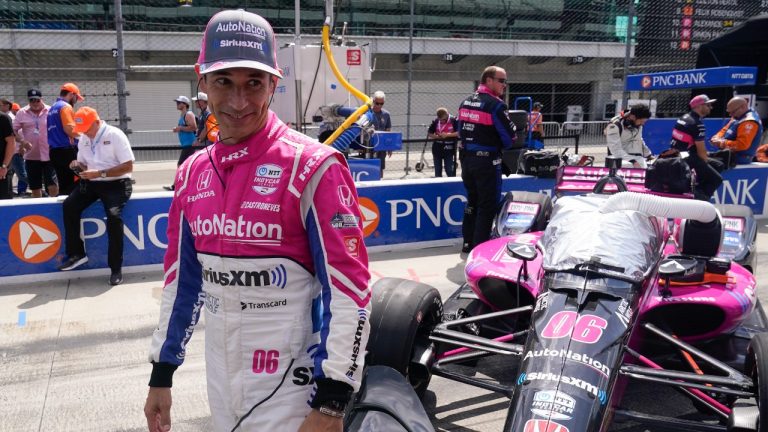 Helio Castroneves, of Brazil, waits in the pits before a IndyCar auto race at Indianapolis Motor Speedway, Saturday, July 30, 2022, in Indianapolis. (Darron Cummings/AP)