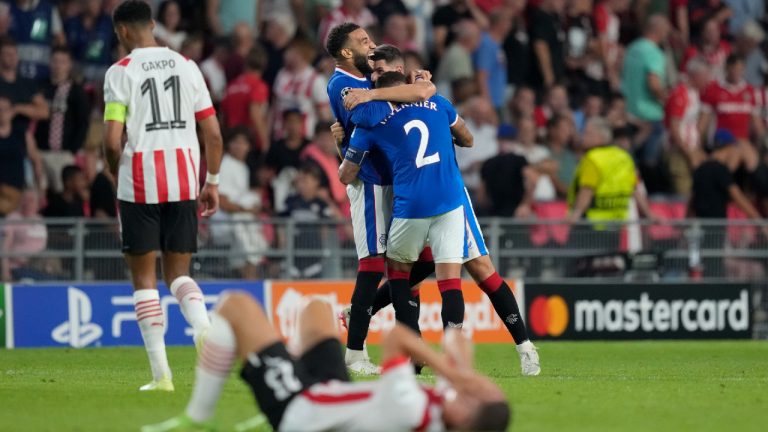 Rangers players celebrate their team's victory at the end of a Champions League playoff second leg soccer match between PSV Eindhoven and Rangers, at the Philips stadium in Eindhoven, Netherlands, Wednesday, Aug. 24, 2022. (Peter Dejong/AP)