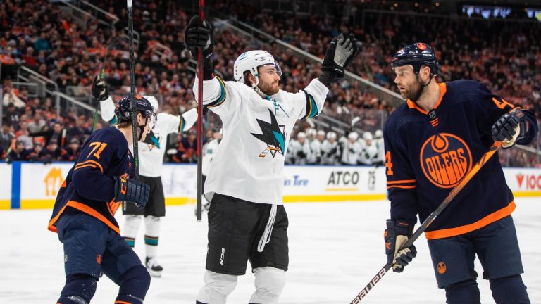 San Jose Sharks' Noah Gregor (73) celebrates his goal as Edmonton Oilers' Ryan McLeod (71) and Zack Kassian (44) skate by during first period NHL action in Edmonton on Thursday, April 28, 2022. (Jason Franson/CP)