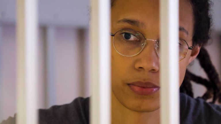 WNBA star and two-time Olympic gold medallist Brittney Griner looks through bars as she listens to the verdict standing in a cage in a courtroom in Khimki just outside Moscow, Russia, Thursday, Aug. 4, 2022. A judge in Russia has convicted American basketball star Brittney Griner of drug possession and smuggling and sentenced her to nine years in prison. (Evgenia Novozhenina/Pool Photo via AP)