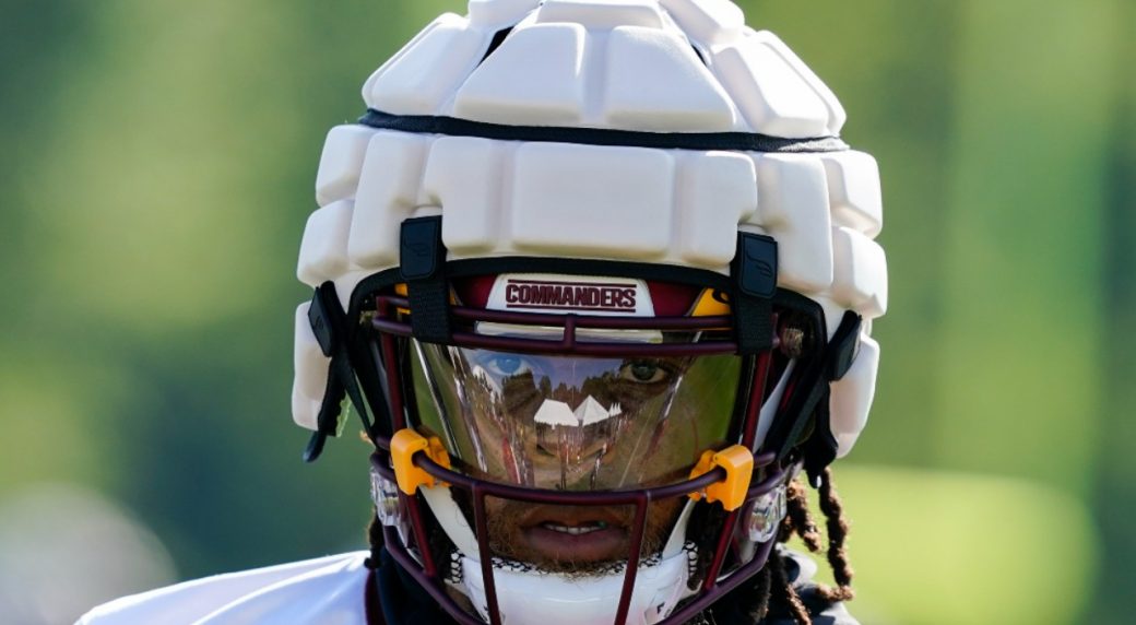 Why are NFL players wearing padding on helmets at training camp?