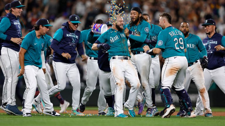 Seattle Mariners' Mitch Haniger celebrates his RBI single to win 3-2 against the Cleveland Guardians during the 11th inning of a baseball game. (John Froschauer/AP)