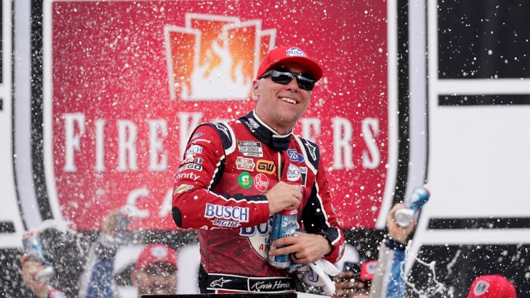 Kevin Harvick celebrates after winning the NASCAR Cup Series auto race at the Michigan International Speedway in Brooklyn, Mich., Sunday, Aug. 7, 2022. (Paul Sancya/AP)