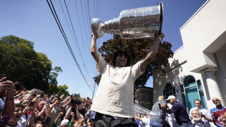 NHL player Nazem Kadri hoist the Stanley Cup in front of the London Muslim Mosque in London, Ontario on Saturday August 27, 2022. Kadri, 31, won the cup for the first time while playing with the Colorado Avalanche. (Geoff Robins/CP)