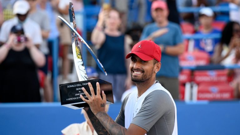 Nick Kyrgios, of Australia, poses with the trophy after he defeated Yoshihito Nishioka, of Japan, during a final at the Citi Open tennis tournament Sunday, Aug. 7, 2022, in Washington. Kyrgios won 6-4, 6-3. (Nick Wass/AP)