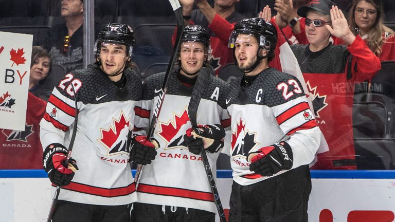 Canada's Ryan O'Rourke (28), Kent Johnson (13) and Mason McTavish (23) celebrate a goal against Slovakia during second period IIHF World Junior Hockey Championship action. (Jason Franson/CP)