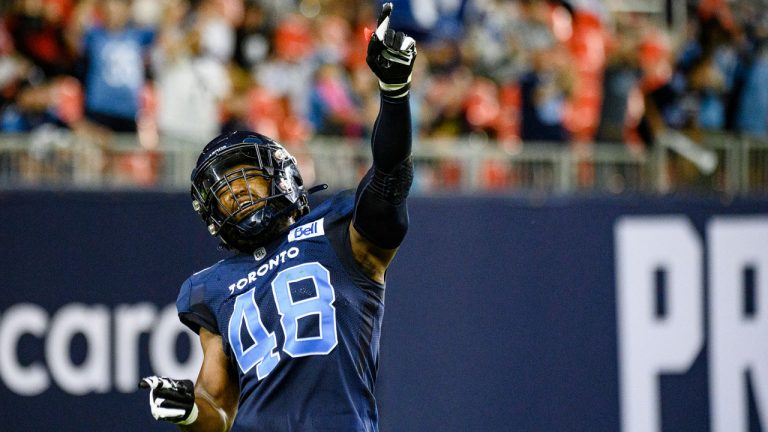 Toronto Argonauts linebacker Wynton McManis (48) celebrates during a break in play against the Hamilton Tiger-Cats during second half CFL football action, in Toronto. (Christopher Katsarov/CP)