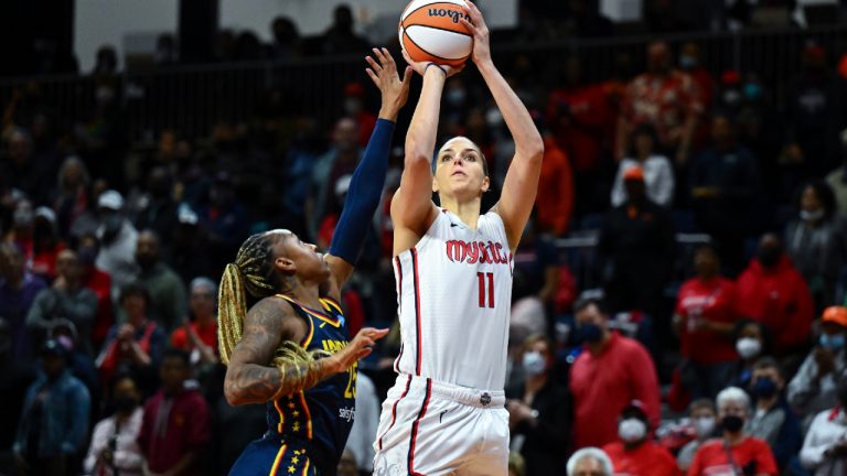 Washington Mystics forward Elena Delle Donne (11) shoots the ball against Indiana Fever guard Tiffany Mitchell (25) during the first half of an WNBA basketball game, Friday, May 6, 2022, in Washington. (Terrance Williams/AP)