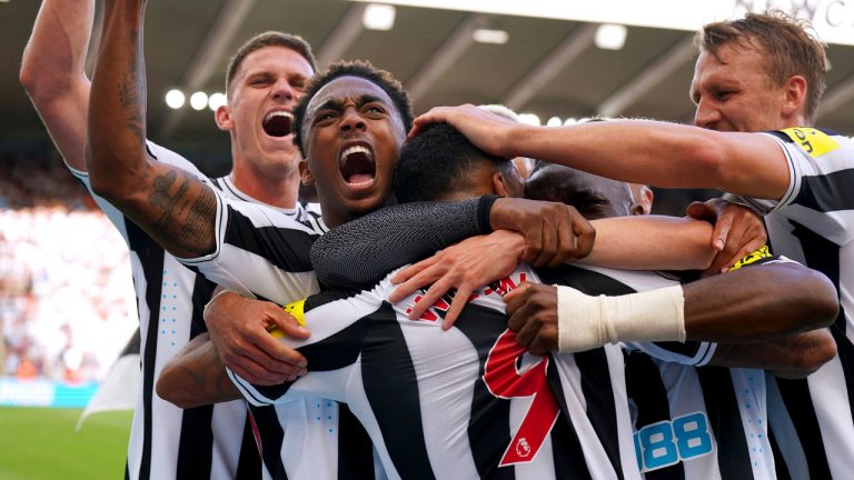 Newcastle United's Callum Wilson celebrates with his teammates after scoring their side's second goal of the game during the English Premier League soccer match at St. James' Park, Newcastle, England. (Owen Humphreys/AP)