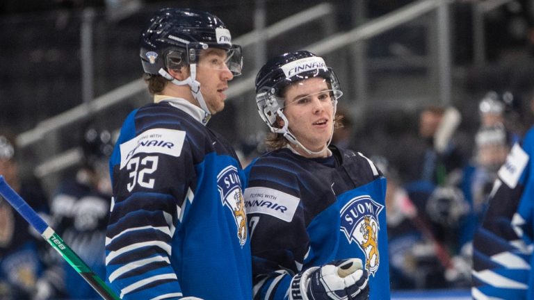 Finland's Joel Määttä (32) and Topi Niemelä (7) celebrate a goal against Austria during third period IIHF World Junior Hockey Championship action in Edmonton, Monday, Dec. 27, 2021. (Jason Franson/CP)