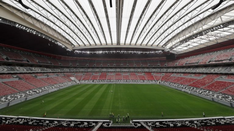 In this Tuesday, Dec. 17, 2019 file photo, workers at the Al Bayt Stadium, one of the 2022 World Cup stadiums, in Al Khor, about 50 kilometres north of Doha, Qatar. The hosts are hoping that FIFA will allow the 2022 World Cup to begin one day earlier than originally planned. (Hassan Ammar/AP)