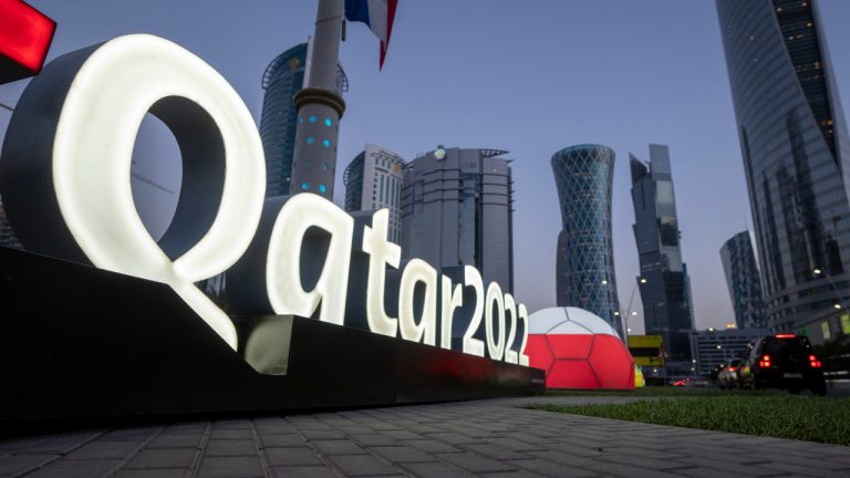 Branding is displayed near the Doha Exhibition and Convention Centre. (Darko Bandic/AP)