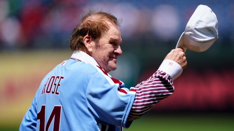 Former Philadelphia Phillies player Pete Rose tips his hat to fans during an alumni day event before a baseball game between the Philadelphia Phillies and the Washington Nationals, Sunday, Aug. 7, 2022, in Philadelphia. (Matt Rourke/AP)