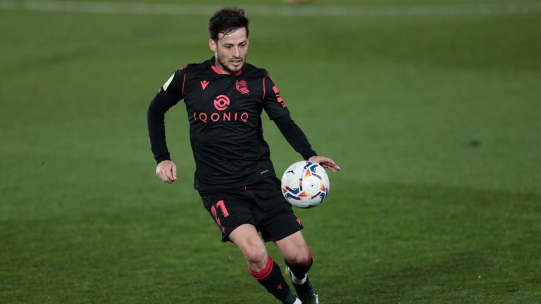 Real Sociedad's David Silva controls the ball during the Spanish La Liga soccer match between Real Madrid and Real Sociedad at Alfredo di Stefano stadium in Madrid, Spain, Monday, March 1, 2021. (AP Photo)