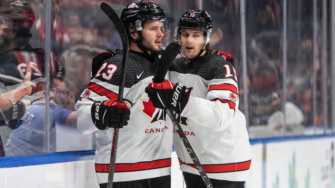 Canada's Mason McTavish (23) and Brennan Othmann (15) celebrate a goal against Slovakia during second period IIHF World Junior Hockey Championship action in Edmonton on Thursday August 11, 2022. (Jason Franson/CP)