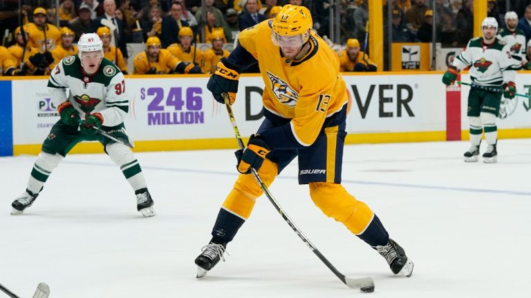 Nashville Predators' Yakov Trenin (13) shoots against the Minnesota Wild in the second period of an NHL hockey game Tuesday, April 5, 2022, in Nashville, Tenn. (Mark Humphrey/AP)