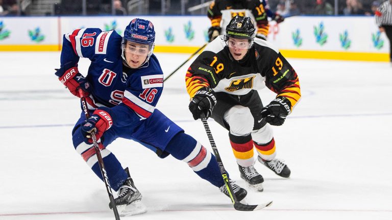 USA's Dominic James (16) and Germany's Haakon Hanelt (19) battle for the puck during second period IIHF World Junior Hockey Championship action in Edmonton. (Jason Franson/CP)