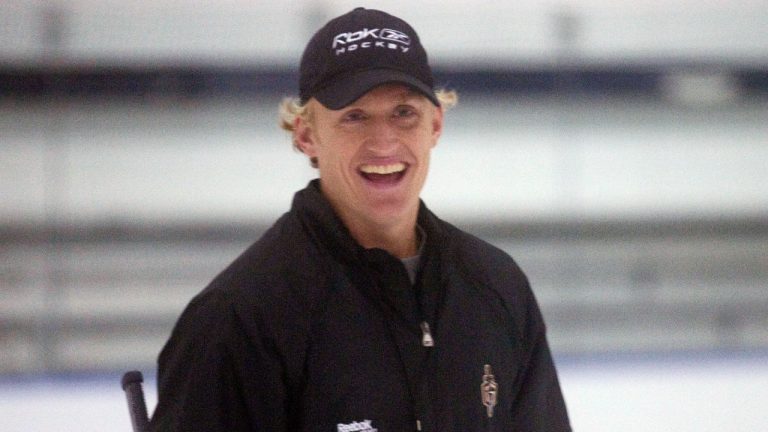 FILE - Head coach for the ECHL's Gwinnett Gladiators, John Wroblewski, right, conducts practice for the team Oct. 5, 2011 in Duluth, Ga. Wroblewski was named the head coach of the U.S. national women's hockey team on May 31, 2022. His new team, which will feature 18 returning Olympians, hit the ice for the first time on Sunday, Aug. 14, 2022, in preparing for the world championships minus Wroblewski after he tested positive for COVID-19. (David Goldman/AP)