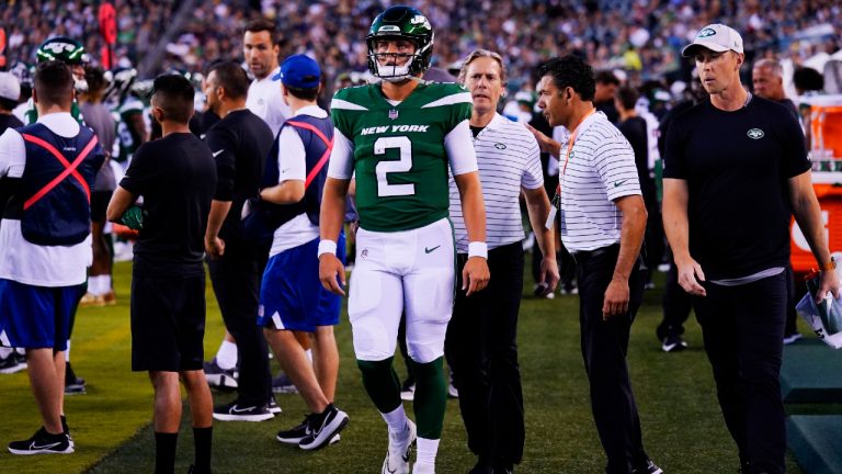 New York Jets' Zach Wilson walks on the sidelines after he is taken off the field following an injury during the first half of a preseason NFL football game against the Philadelphia Eagles on Friday, Aug. 12, 2022, in Philadelphia. (Matt Rourke/AP)