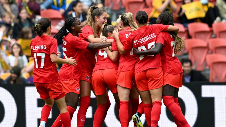 Adriana Leon, center, of Canada celebrates after scoring a goal with teammates during the women's soccer friendly between Australia and Canada at Suncorp Stadium in Brisbane, Australia, Saturday, Sept. 3, 2022. (Darren England/AAP Image via AP)