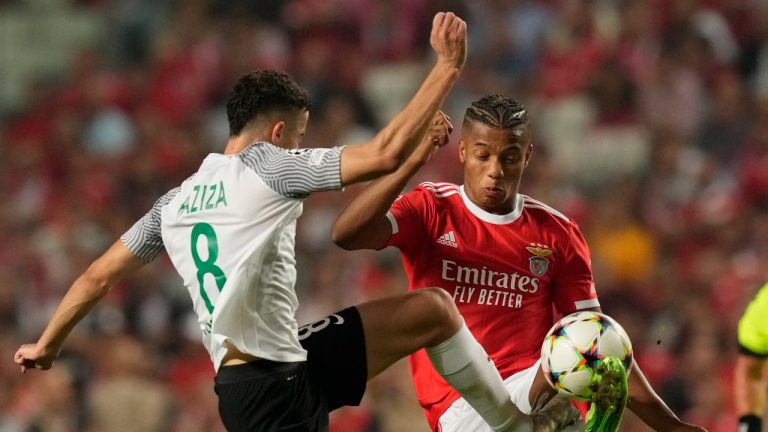 Maccabi's Dolev Haziza, left, and Benfica's David Neres vie for the ball during the Champions League group H soccer match between Benfica and Maccabi Haifa at the Luz stadium in Lisbon, Tuesday, Sept. 6, 2022. (Armando Franca/AP Photo)