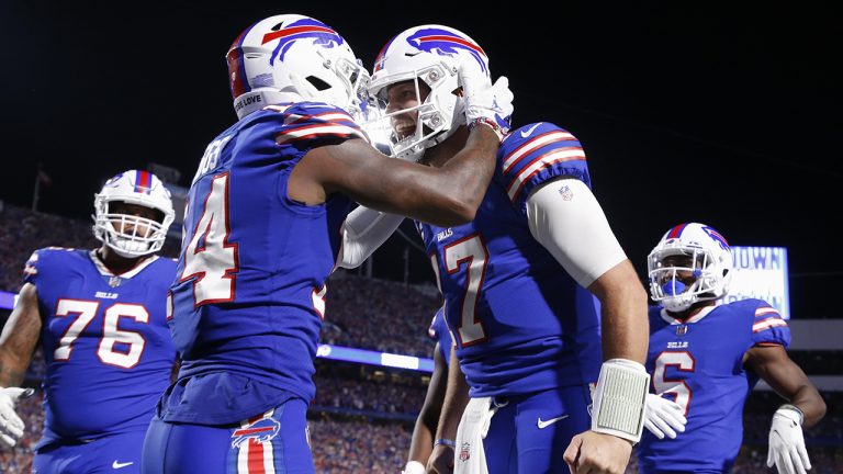 Buffalo Bills' Stefon Diggs, second from left, celebrates with quarterback Josh Allen, second from right, after they connected for a touchdown during the second half of an NFL football game against the Tennessee Titans, Monday, Sept. 19, 2022, in Orchard Park, N.Y. (Jeffrey T. Barnes/AP)