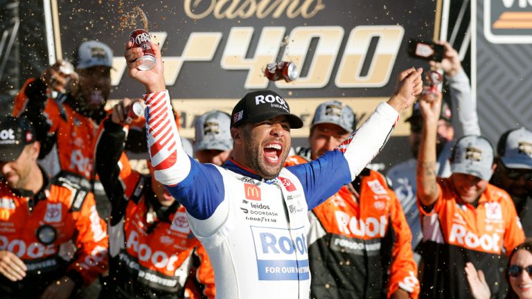 Bubba Wallace celebrates in Victory Lane after winning a NASCAR Cup Series auto race at Kansas Speedway in Kansas City, Kan., Sunday, Sept. 11, 2022. (Colin E. Braley/AP)