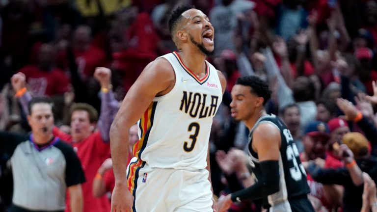 New Orleans Pelicans guard CJ McCollum (3) reacts with the crowd after scoring a 3-point basket in the first half of an NBA play-in basketball game against the San Antonio Spurs in New Orleans, Wednesday, April 13, 2022. (Gerald Herbert/AP)